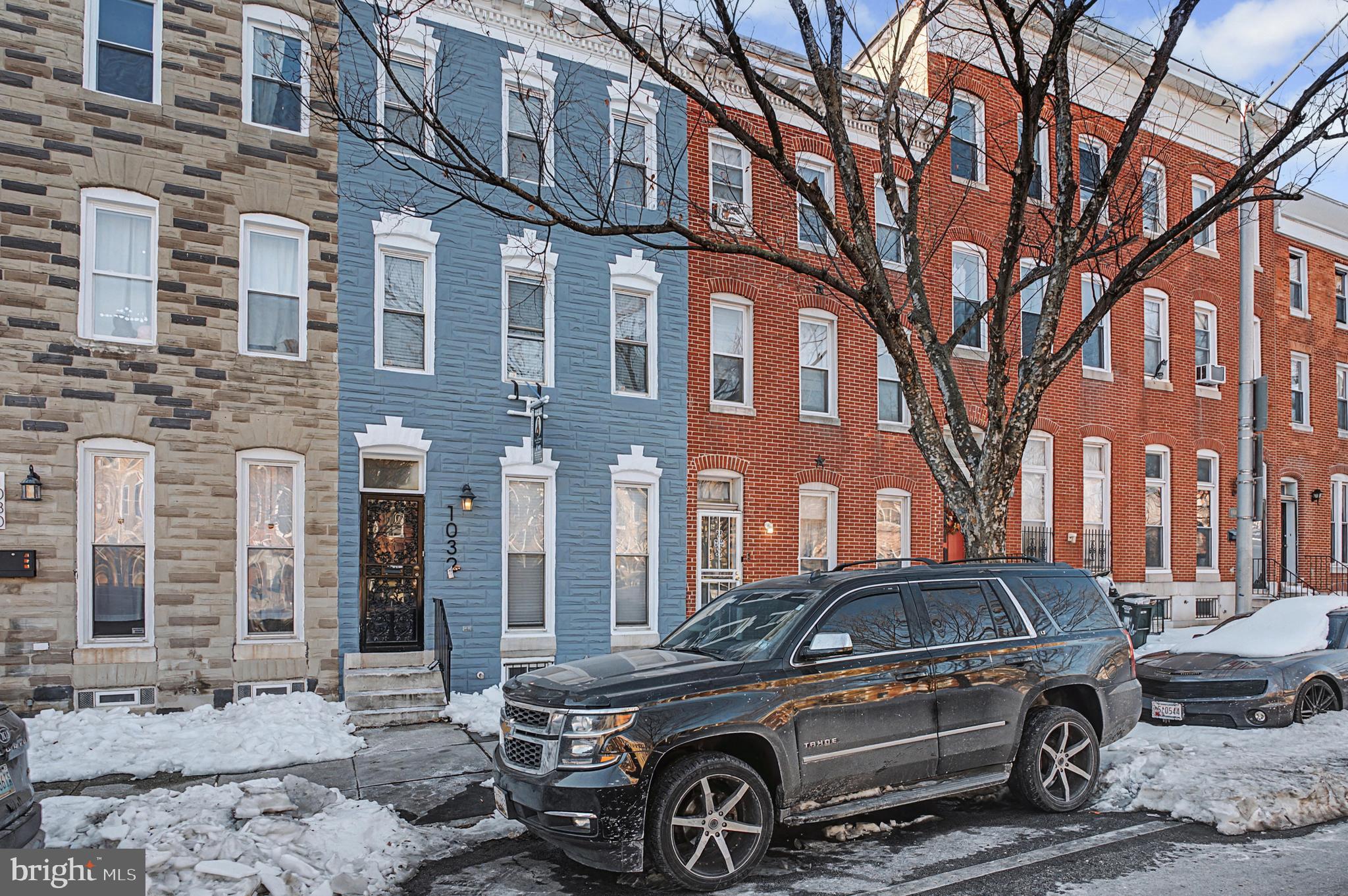 a view of a car parked in front of a building
