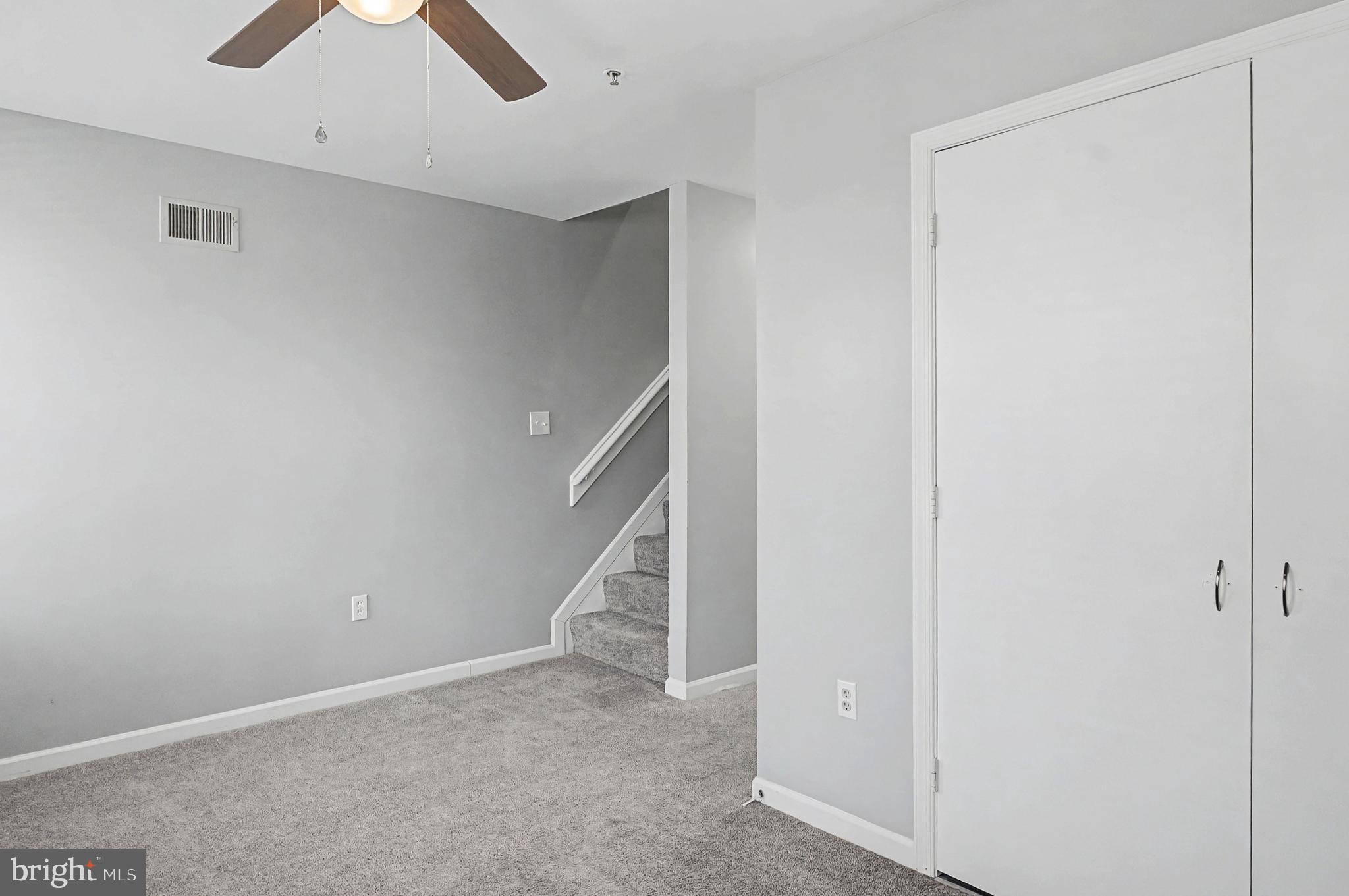 1032 North Broadway Baltimore, MD 21205 - Photo 17 of 28 an empty room with ceiling fan and window