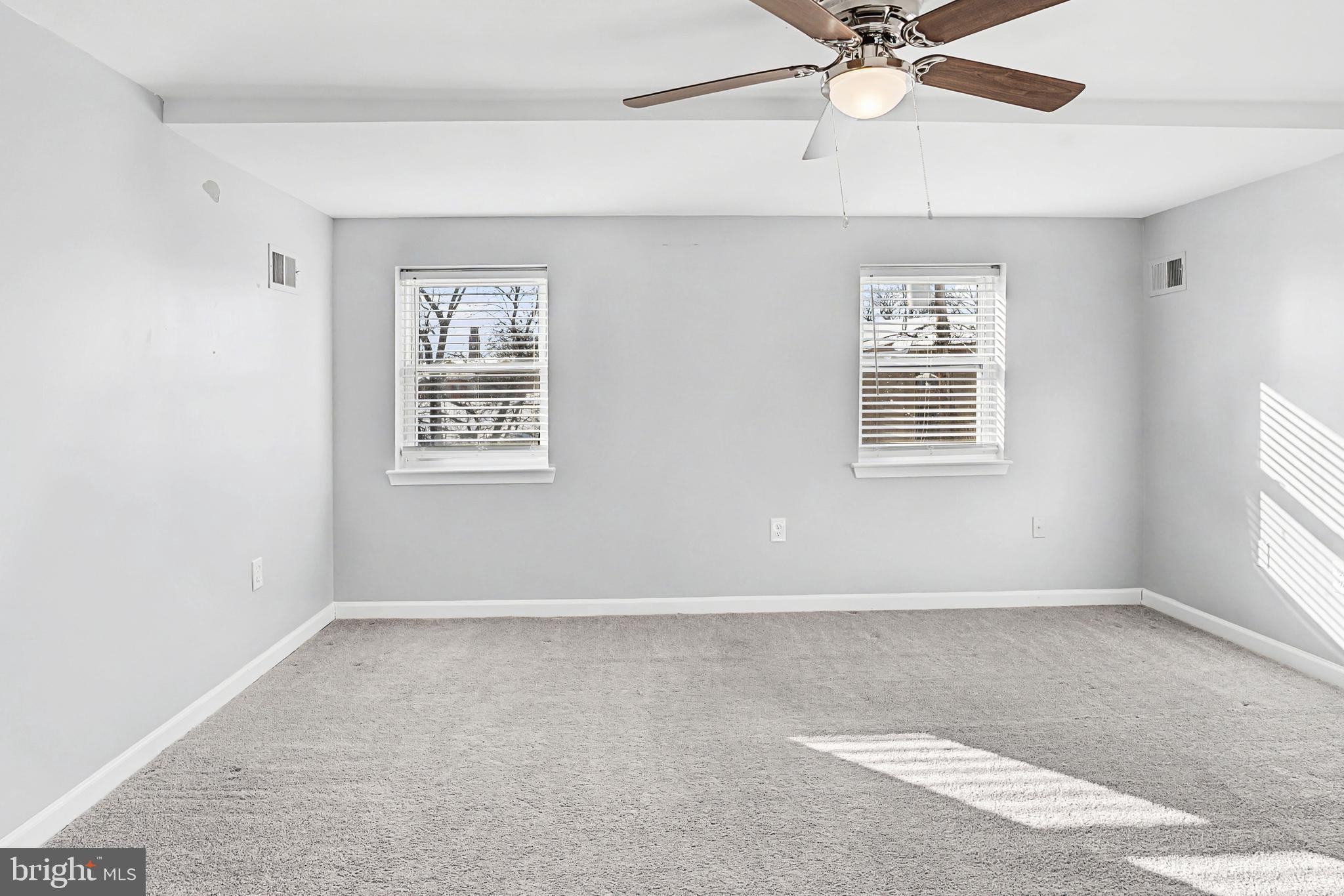 1032 North Broadway Baltimore, MD 21205 - Photo 18 of 28 an empty room with windows and fan