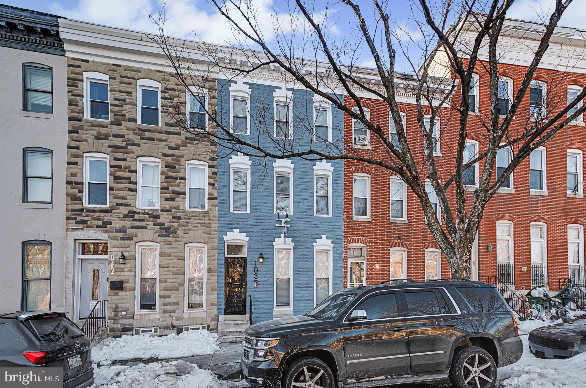 1032 North Broadway Baltimore, MD 21205 - Photo 6 of 28 a front view of a building with parking space