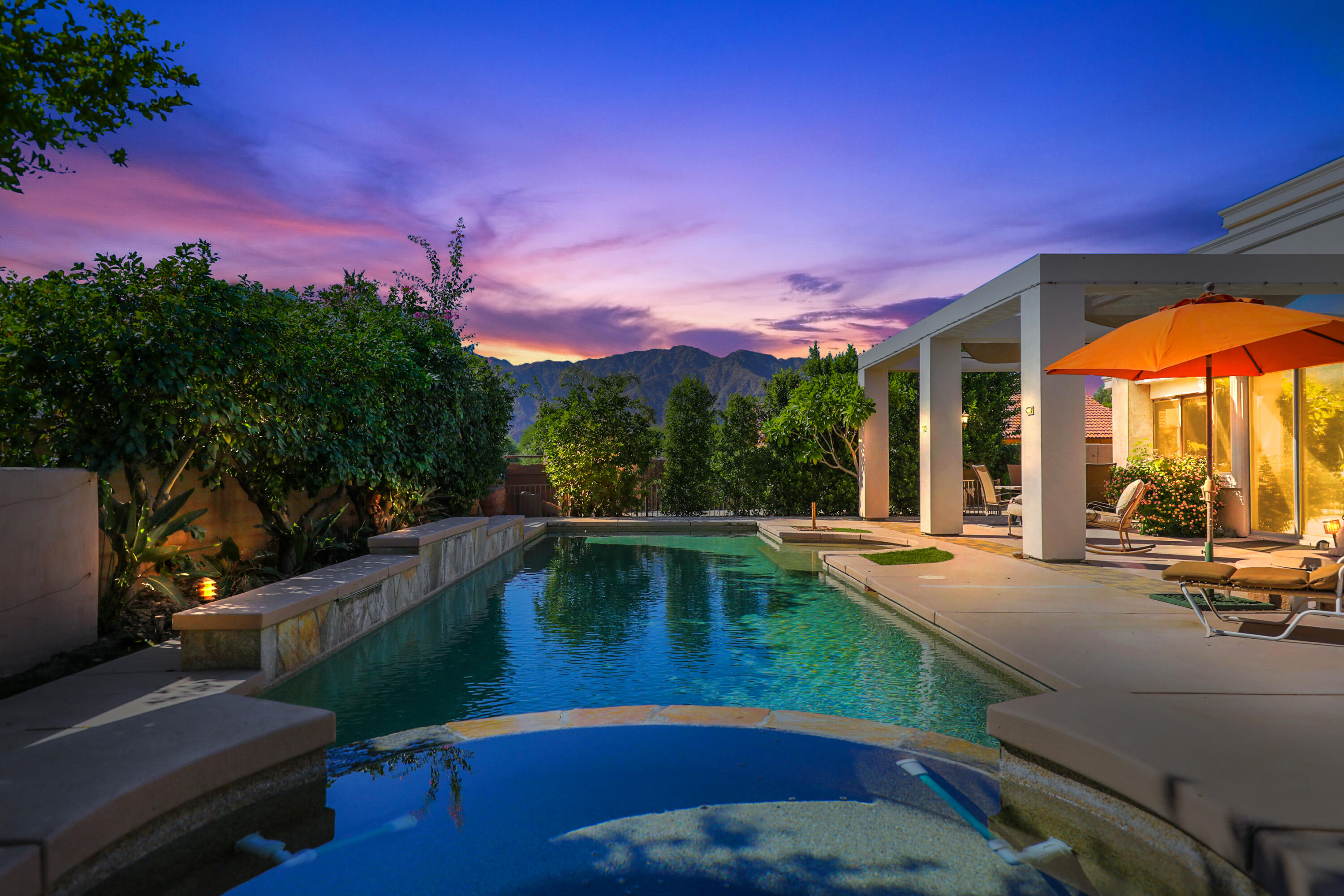 a view of a patio with swimming pool