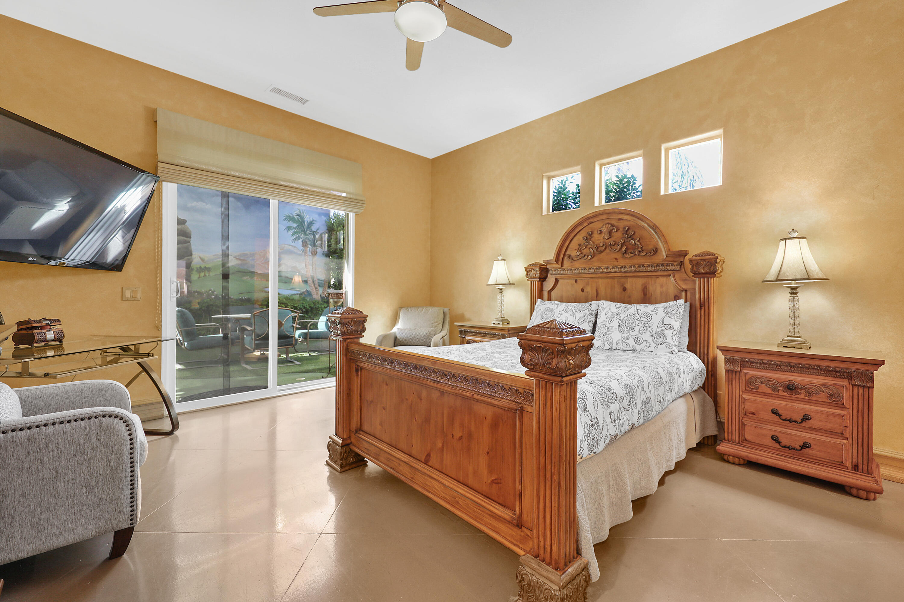 78680 Ave Tujunga La Quinta, CA 92253 - Photo 16 of 41 a bed room with a bed and a tv