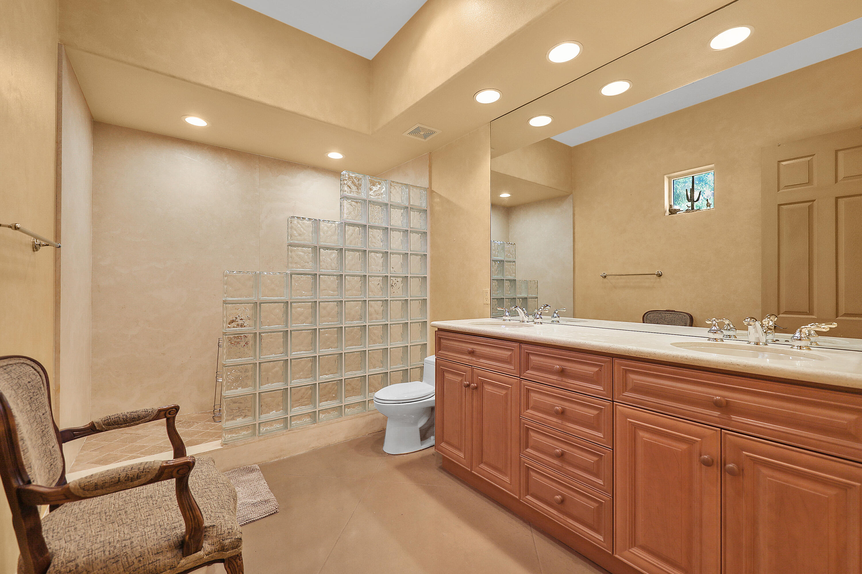 78680 Ave Tujunga La Quinta, CA 92253 - Photo 17 of 41 a bathroom with a sink a toilet and a mirror
