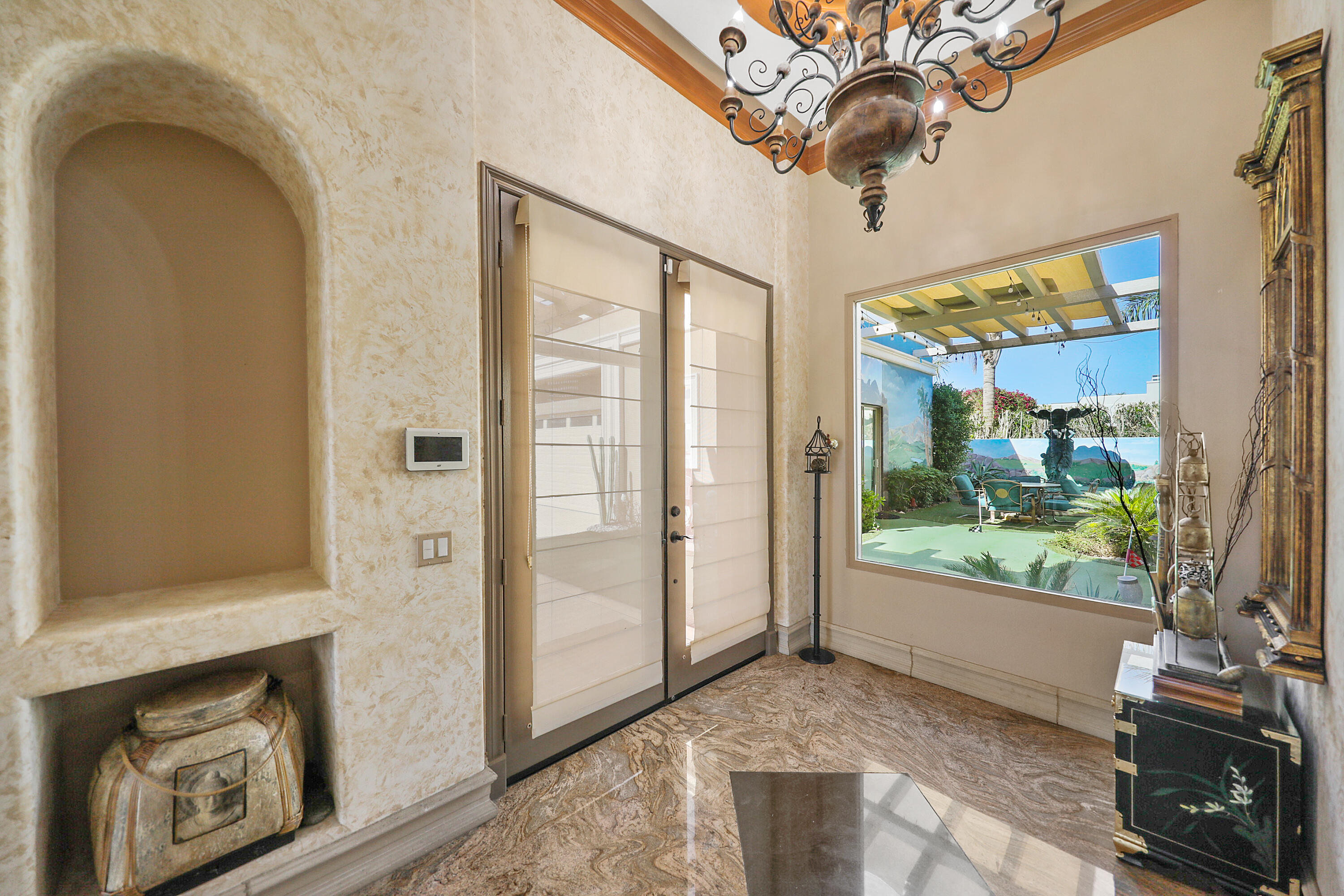 78680 Ave Tujunga La Quinta, CA 92253 - Photo 2 of 41 a view of an entryway with a fireplace