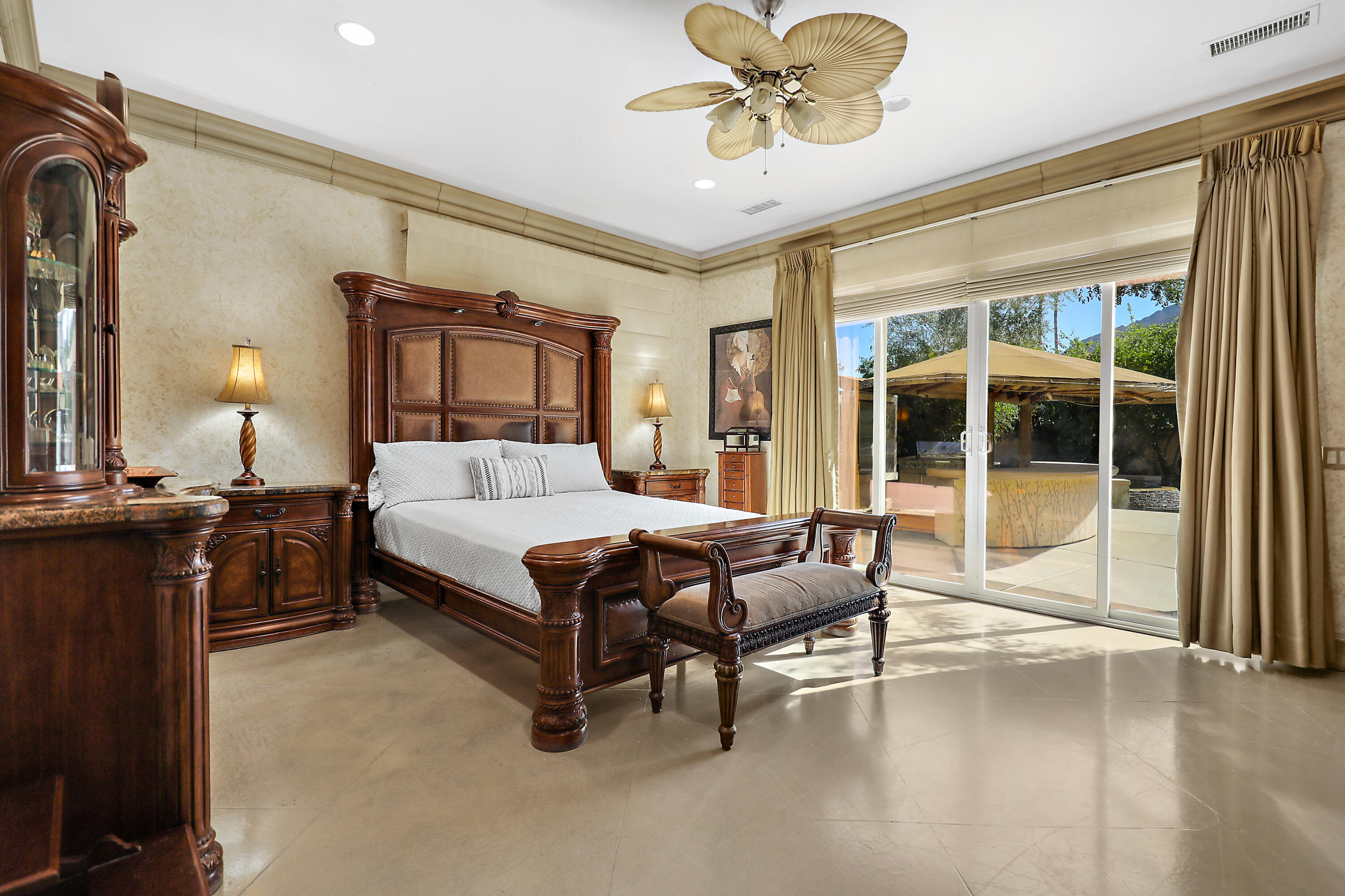 78680 Ave Tujunga La Quinta, CA 92253 - Photo 21 of 41 a bedroom with a bed and wooden floor