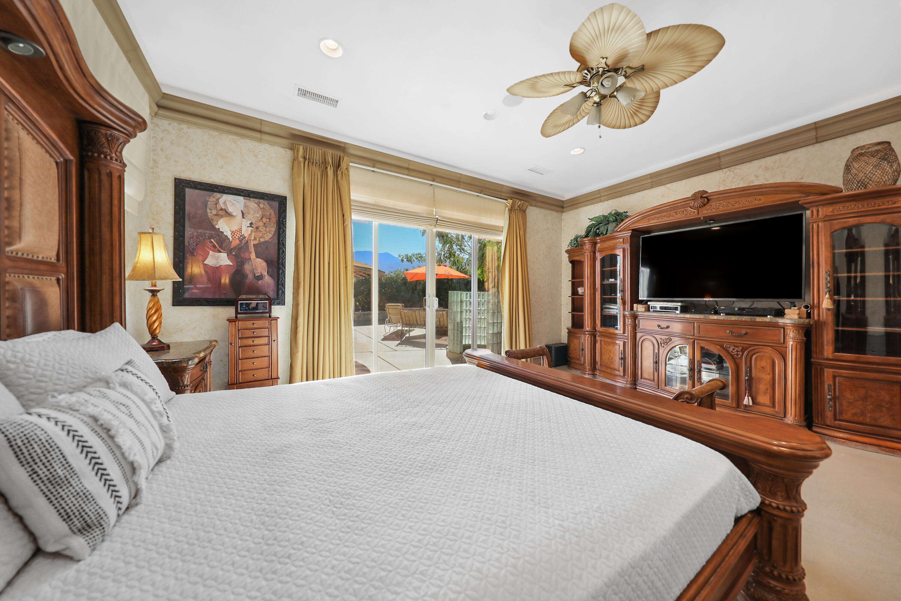 78680 Ave Tujunga La Quinta, CA 92253 - Photo 22 of 41 a bedroom with a bed and a flat screen tv