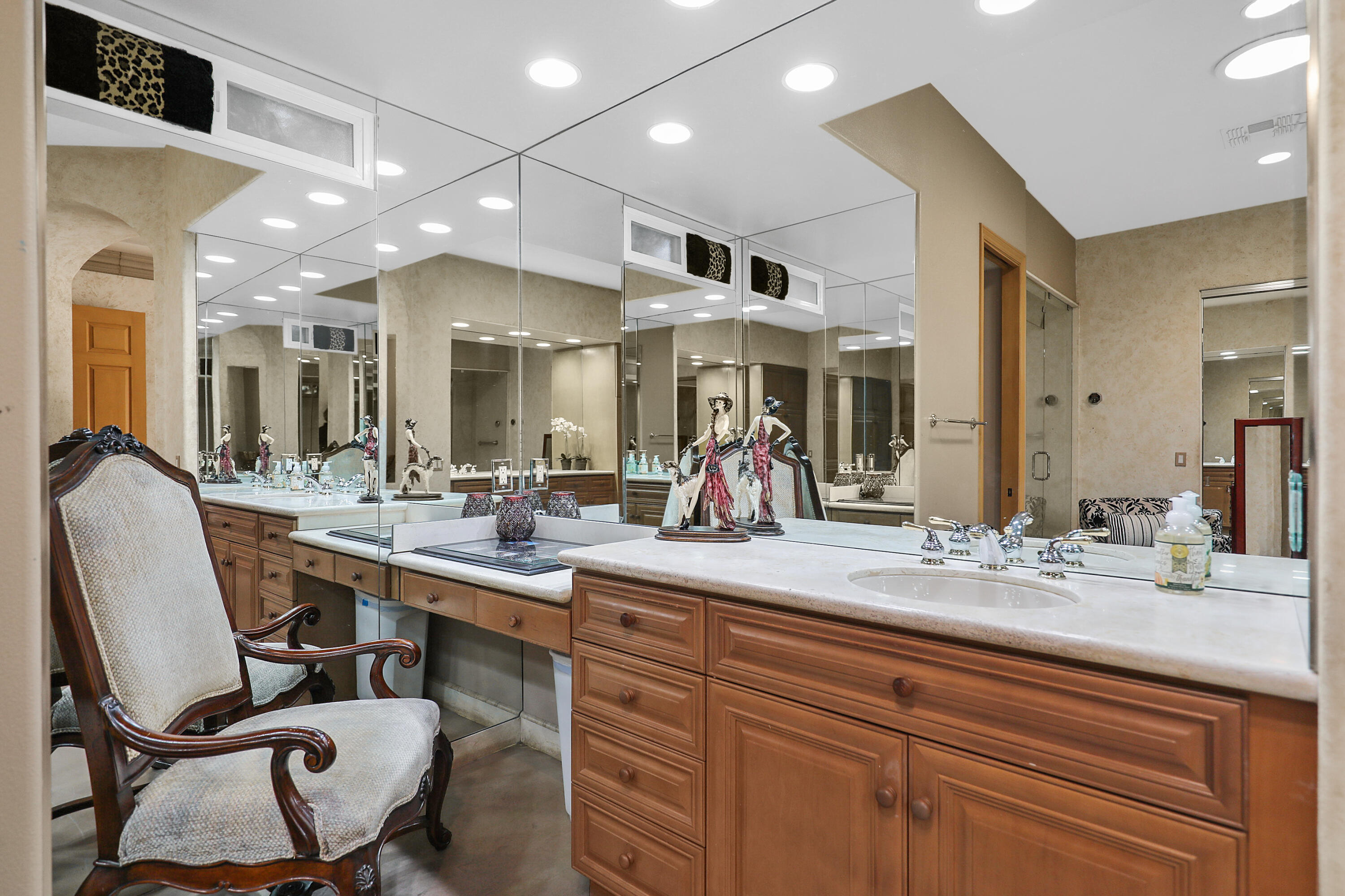 78680 Ave Tujunga La Quinta, CA 92253 - Photo 25 of 41 a dining hall with stainless steel appliances kitchen island granite countertop furniture a sink and a large mirror