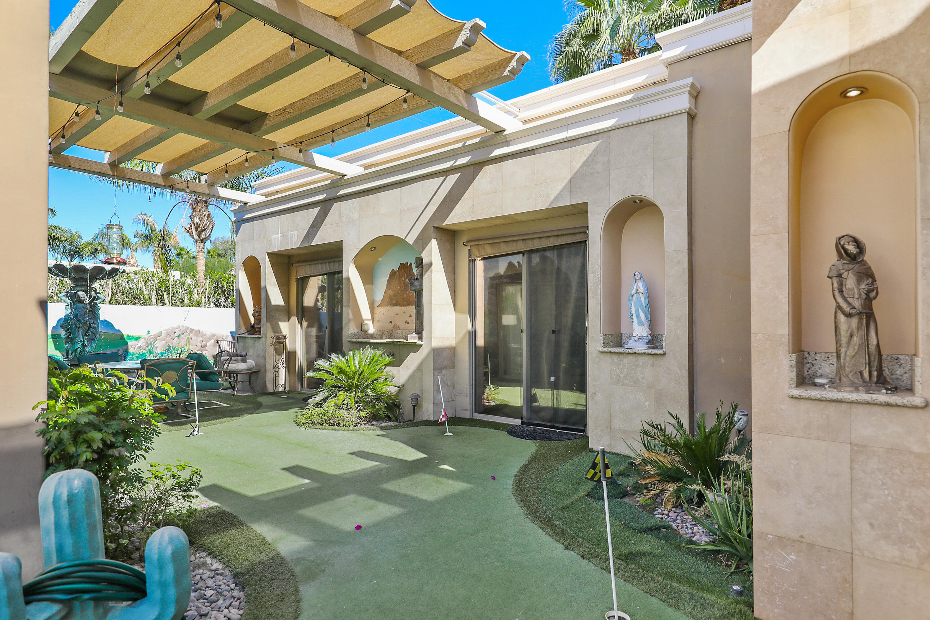 78680 Ave Tujunga La Quinta, CA 92253 - Photo 39 of 41 a front view of a house with garden