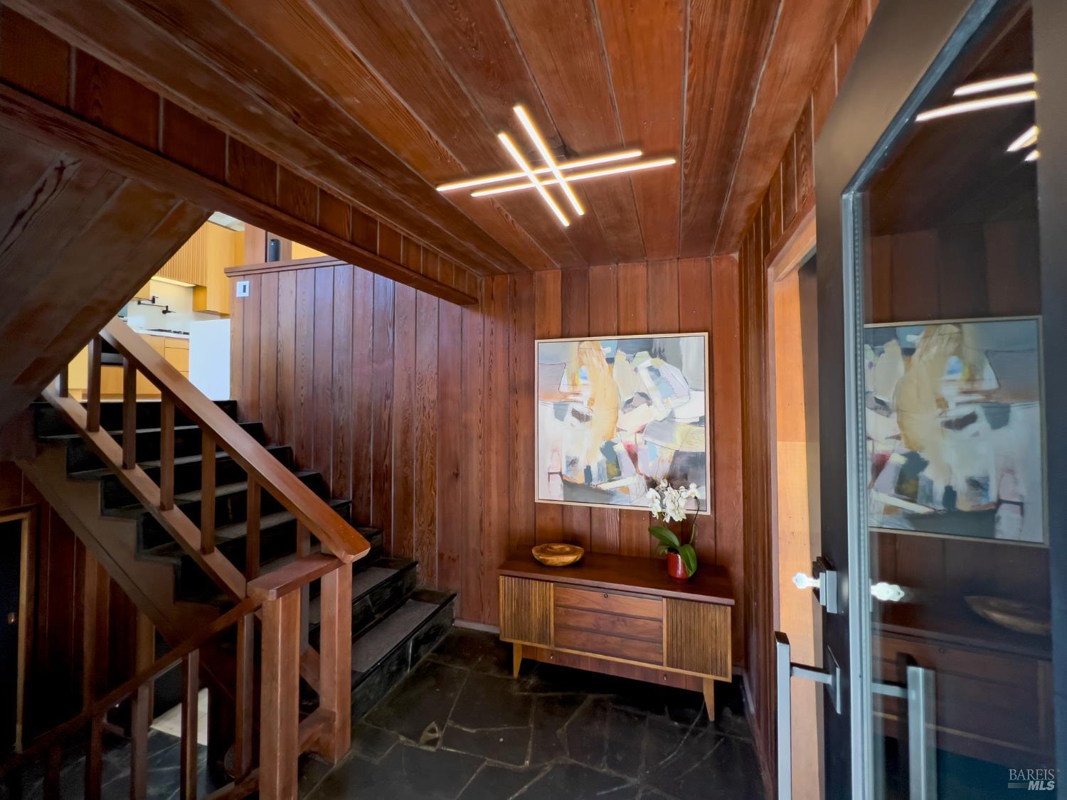 16620 Guernewood Road Guerneville, CA 95446 - Photo 8 of 68 Front staircase leads either to kitchen on the second floor, or downstairs to an auxiliary living / play space.