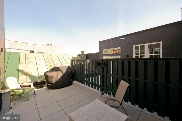 a view of balcony with furniture