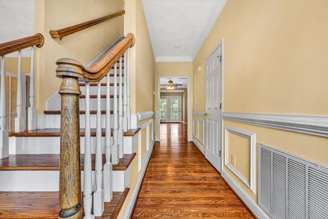 a large kitchen with stainless steel appliances granite countertop a stove top oven a refrigerator and a sink