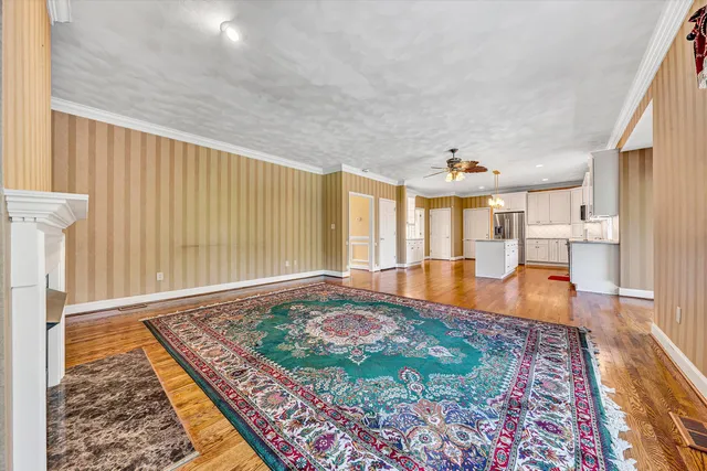 a balcony with wooden floor and fence