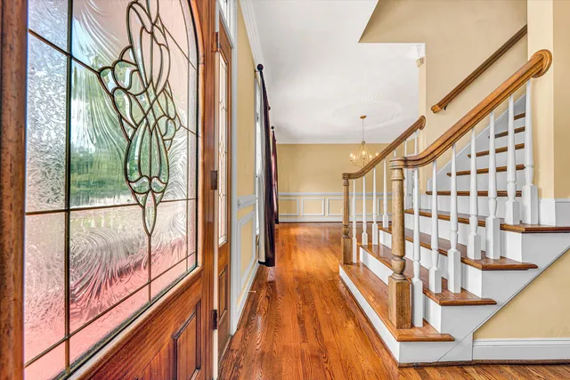 a view of kitchen with sink and refrigerator