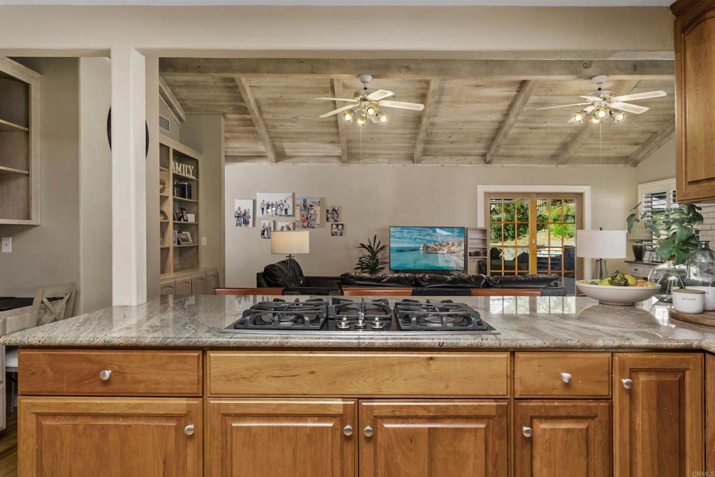 2614 Secret Lake Lane Fallbrook, CA 92028 - Photo 13 of 60 a kitchen with a sink and cabinets