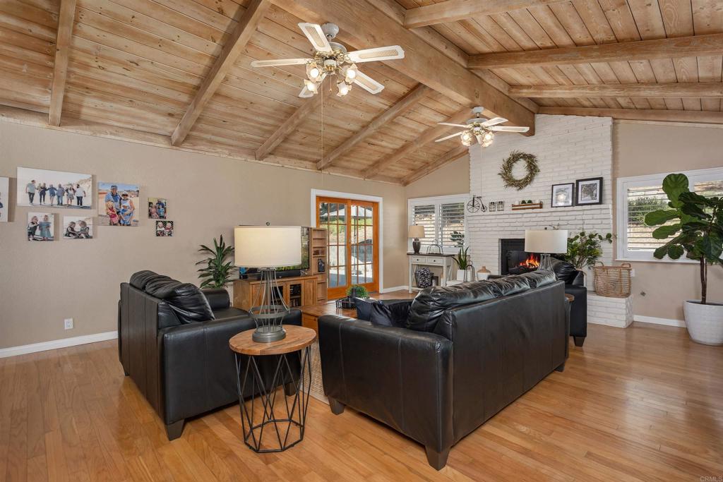 2614 Secret Lake Lane Fallbrook, CA 92028 - Photo 14 of 60 a living room with furniture and wooden floor