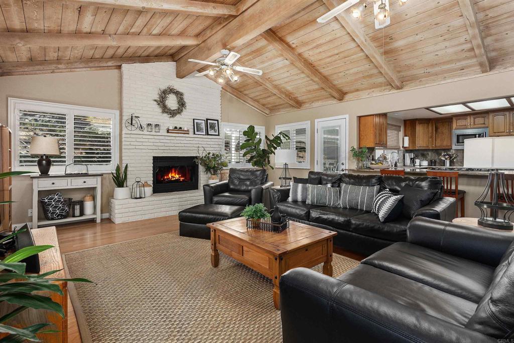 2614 Secret Lake Lane Fallbrook, CA 92028 - Photo 15 of 60 a living room with furniture and a fireplace