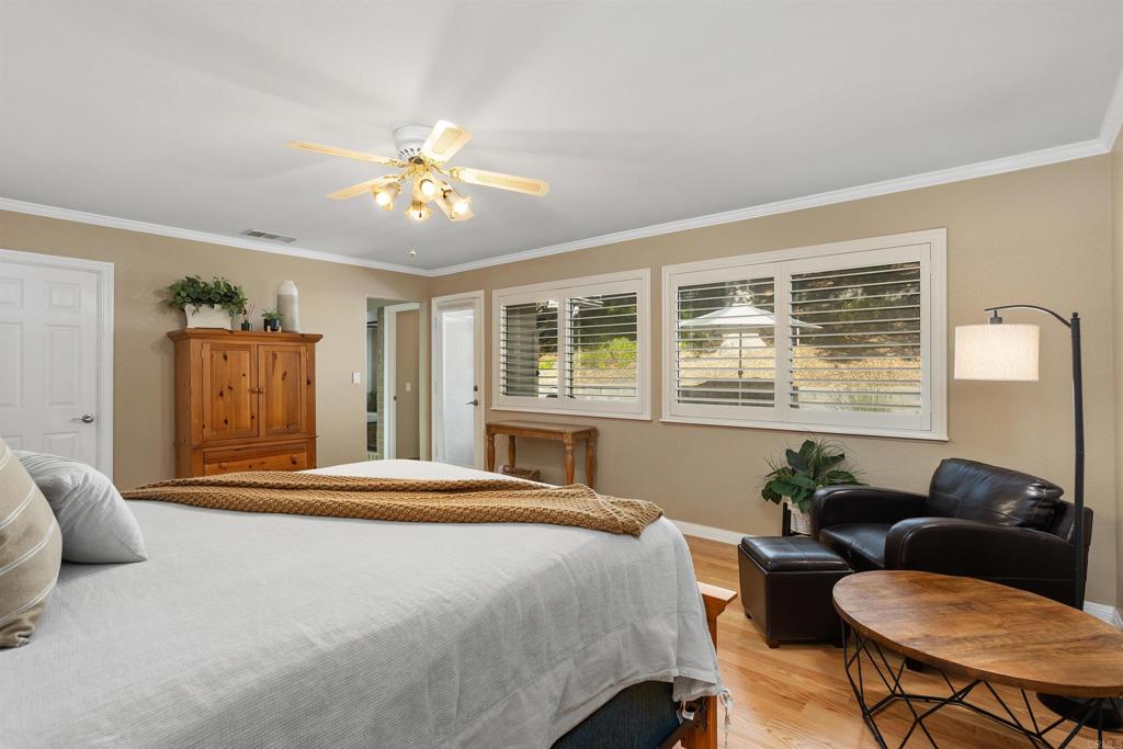 2614 Secret Lake Lane Fallbrook, CA 92028 - Photo 19 of 60 a bedroom with a bed window and couch