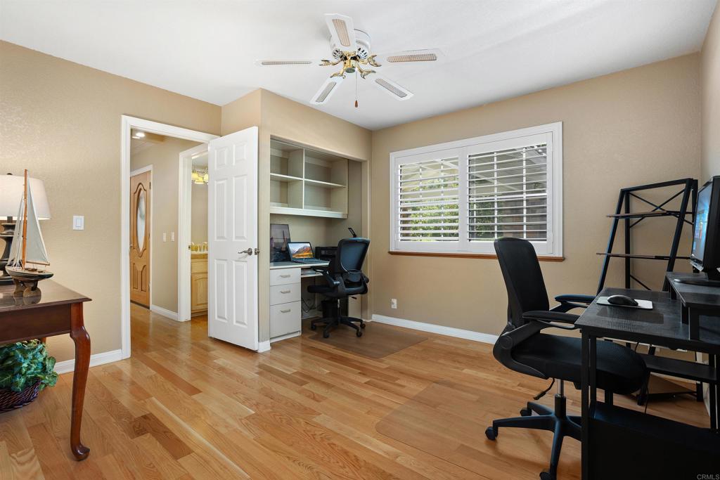 2614 Secret Lake Lane Fallbrook, CA 92028 - Photo 24 of 60 a view of a workspace with furniture and a window