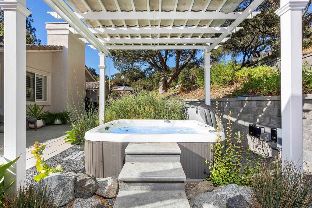 2614 Secret Lake Lane Fallbrook, CA 92028 - Photo 30 of 60 a view of a patio with table and chairs potted plants