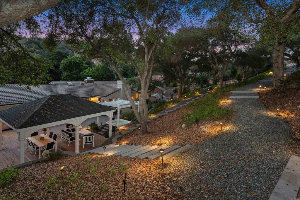 2614 Secret Lake Lane Fallbrook, CA 92028 - Photo 41 of 60 a view of a wooden house with large trees