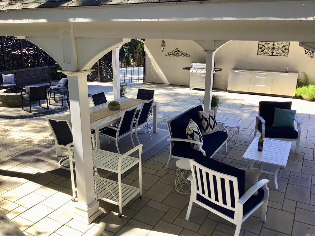 2614 Secret Lake Lane Fallbrook, CA 92028 - Photo 46 of 60 a balcony with table and chairs