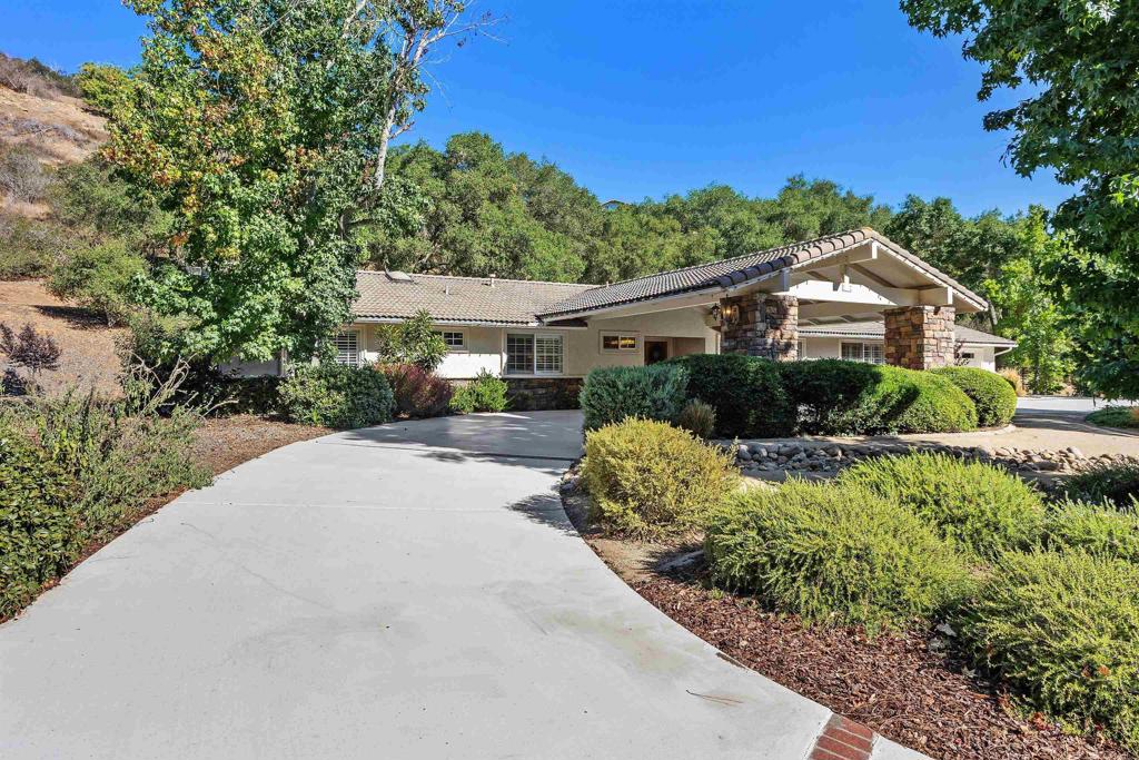 2614 Secret Lake Lane Fallbrook, CA 92028 - Photo 51 of 60 a front view of a house with a yard