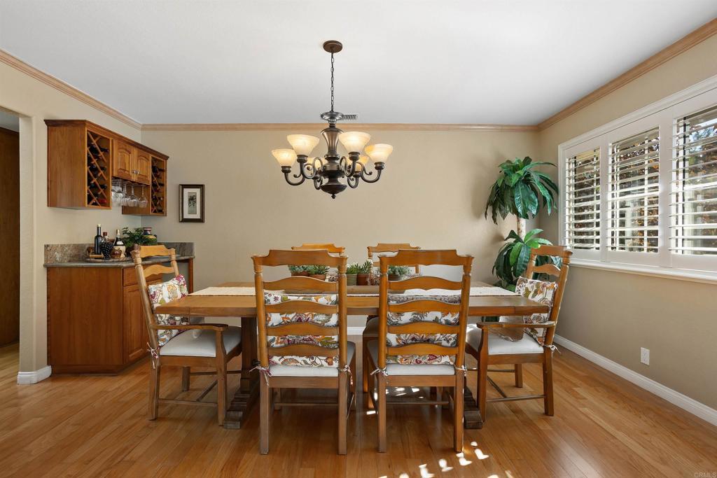 2614 Secret Lake Lane Fallbrook, CA 92028 - Photo 9 of 60 a view of a dining room with furniture window and wooden floor