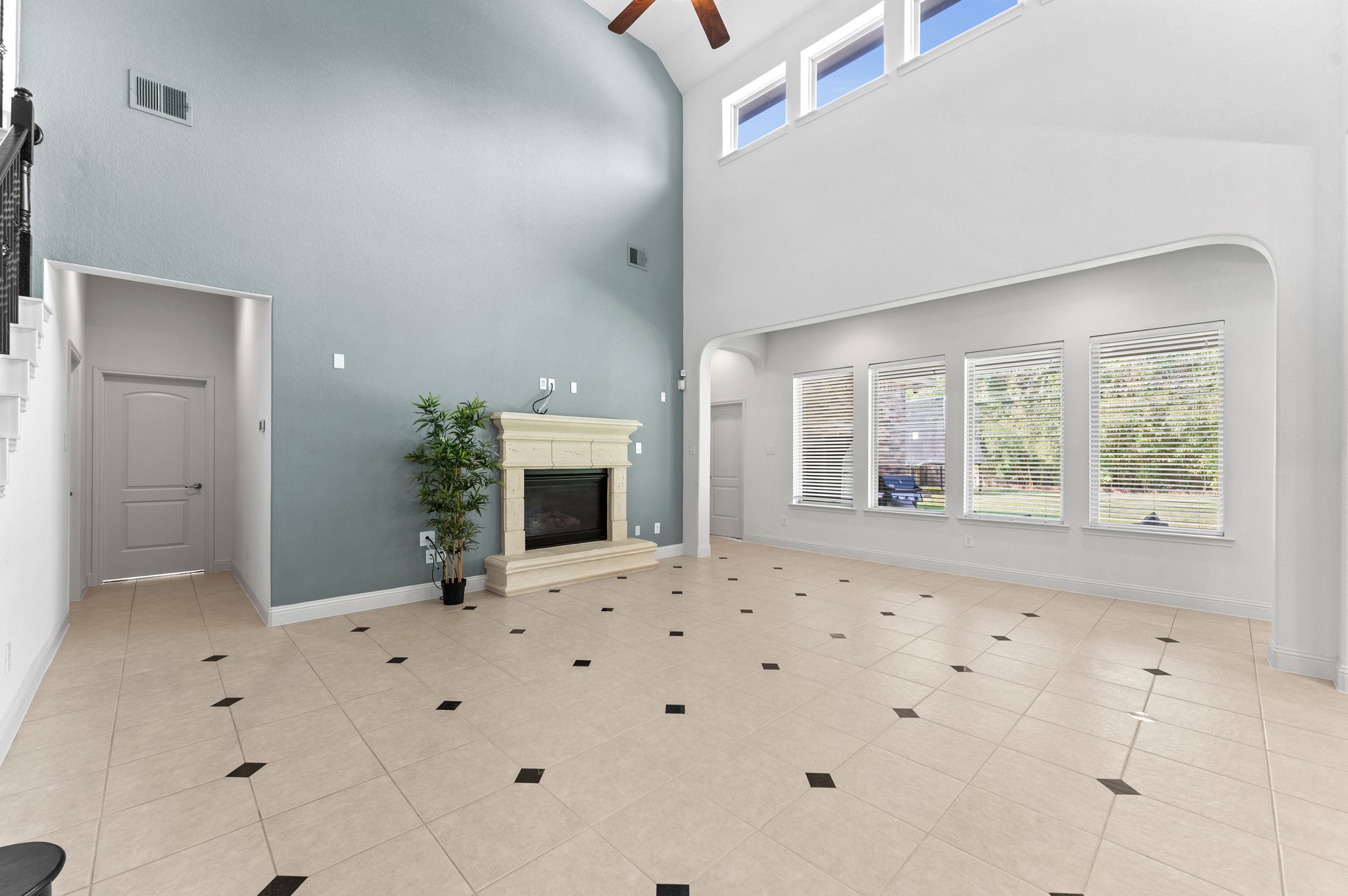39 Tioga Place Tomball, TX 77375 - Photo 15 of 50 a view of an empty room with a fireplace and a window