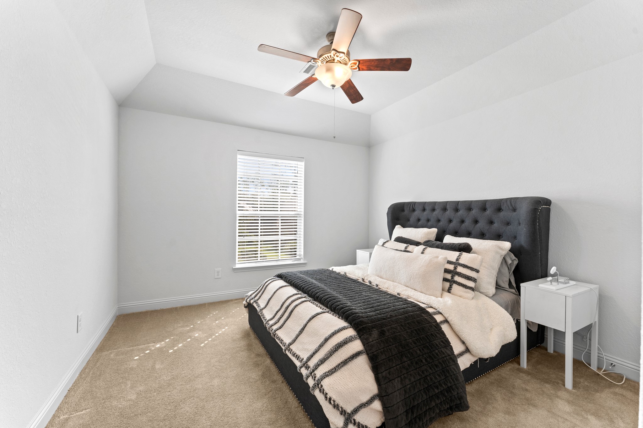 39 Tioga Place Tomball, TX 77375 - Photo 29 of 50 a bedroom with a bed and a window