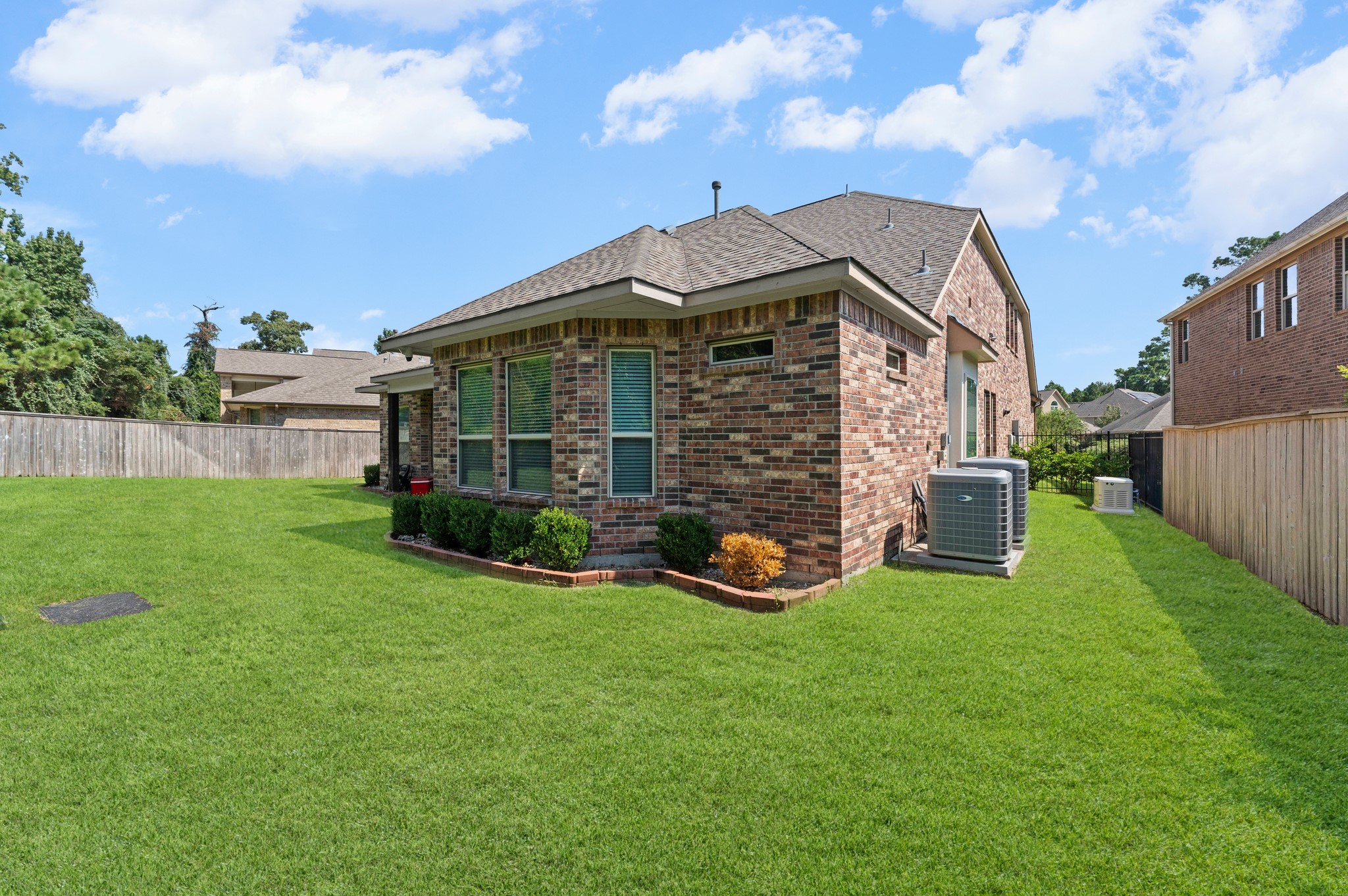39 Tioga Place Tomball, TX 77375 - Photo 42 of 50 a view of a house with backyard and porch
