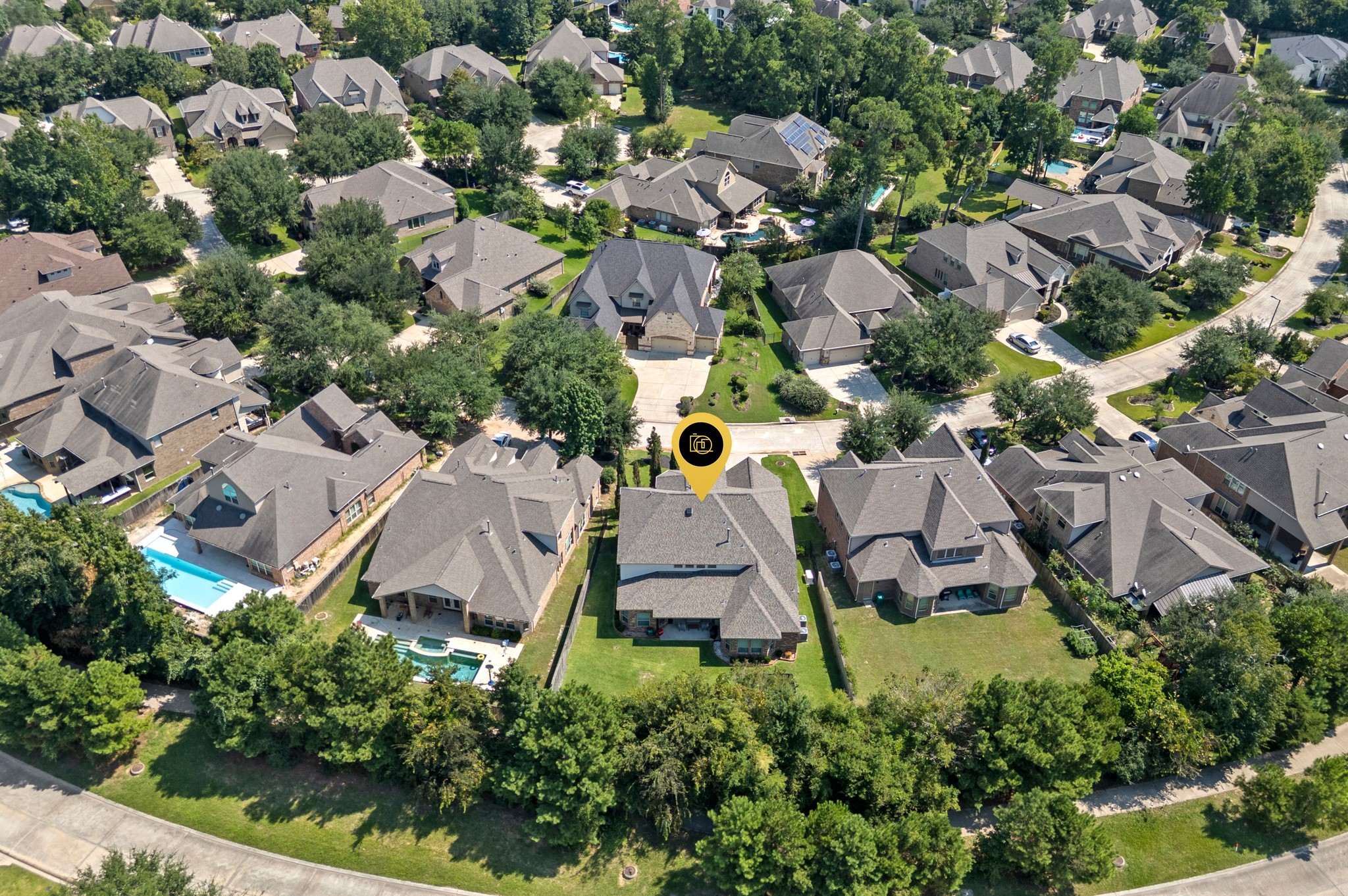 39 Tioga Place Tomball, TX 77375 - Photo 48 of 50 an aerial view of residential house with outdoor space and trees all around
