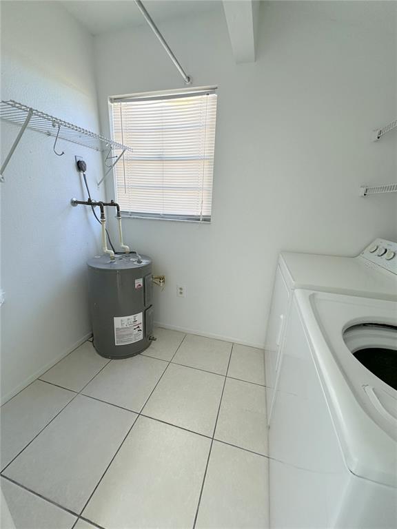 320 Boundary Boulevard, Unit A Rotonda West, FL 33947 - Photo 5 of 11 a utility room with washer and dryer