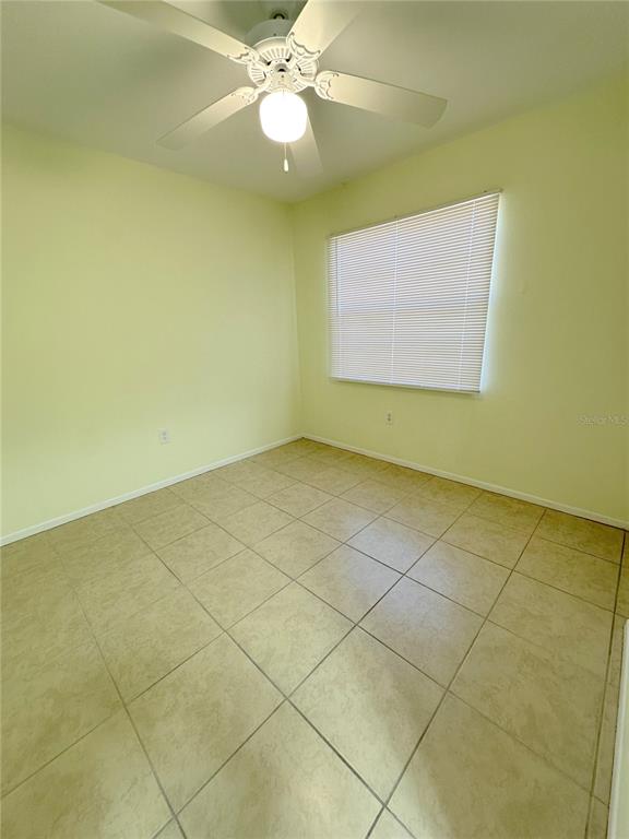 320 Boundary Boulevard, Unit A Rotonda West, FL 33947 - Photo 8 of 11 a view of an empty room with a window