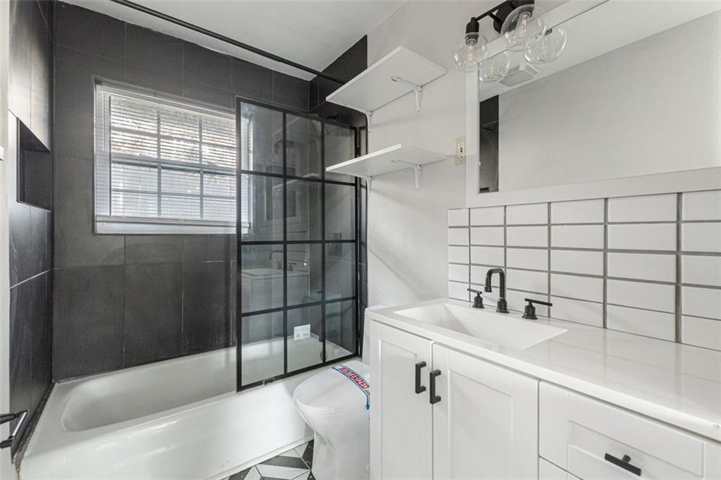 919 Hobson Street Southwest Atlanta, GA 30310 - Photo 11 of 24 a bathroom with a sink toilet and shower