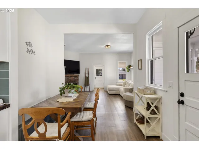 a bedroom with a bed and a view of kitchen