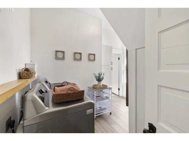 a bathroom with a sink vanity mirror and tub