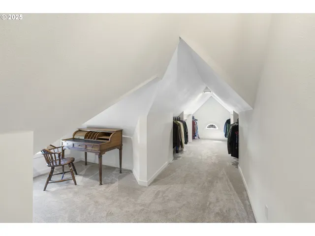 a view of a hallway with table and couch