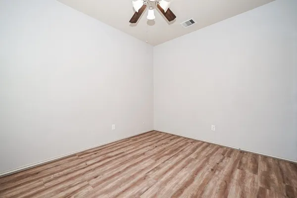 a view of a hallway with shower