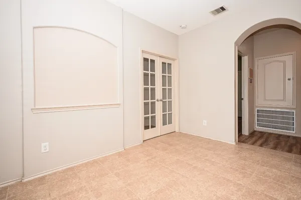 a large kitchen with a large window and a sink