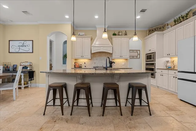 a bedroom with furniture and a book shelf