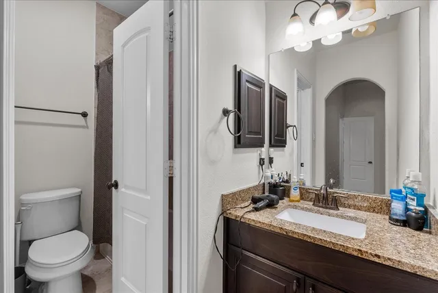 a bedroom with a bed and dresser