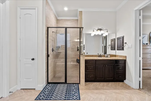 a bathroom with a tub a double vanity sink and a mirror