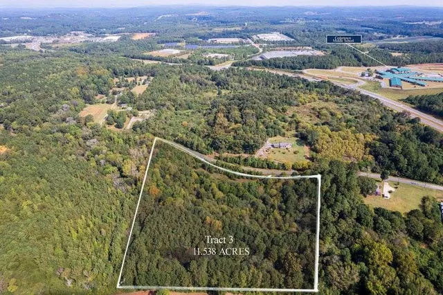 an aerial view of residential house and outdoor space