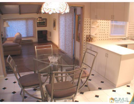 11 Hughes Road Somerset, NJ 08873 - Photo 3 of 9 a view of a chairs and table in a patio