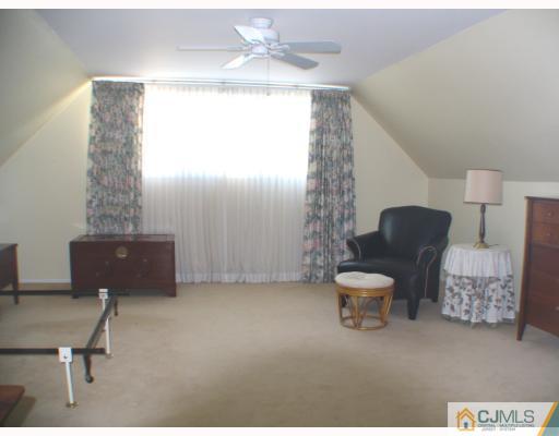 11 Hughes Road Somerset, NJ 08873 - Photo 5 of 9 a living room with furniture and a window