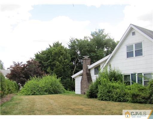 11 Hughes Road Somerset, NJ 08873 - Photo 6 of 9 a backyard of a house with lots of green space