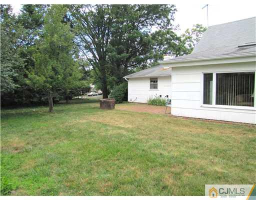 11 Hughes Road Somerset, NJ 08873 - Photo 7 of 9 a house view with a garden space