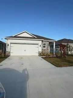 a front view of a house with a garage