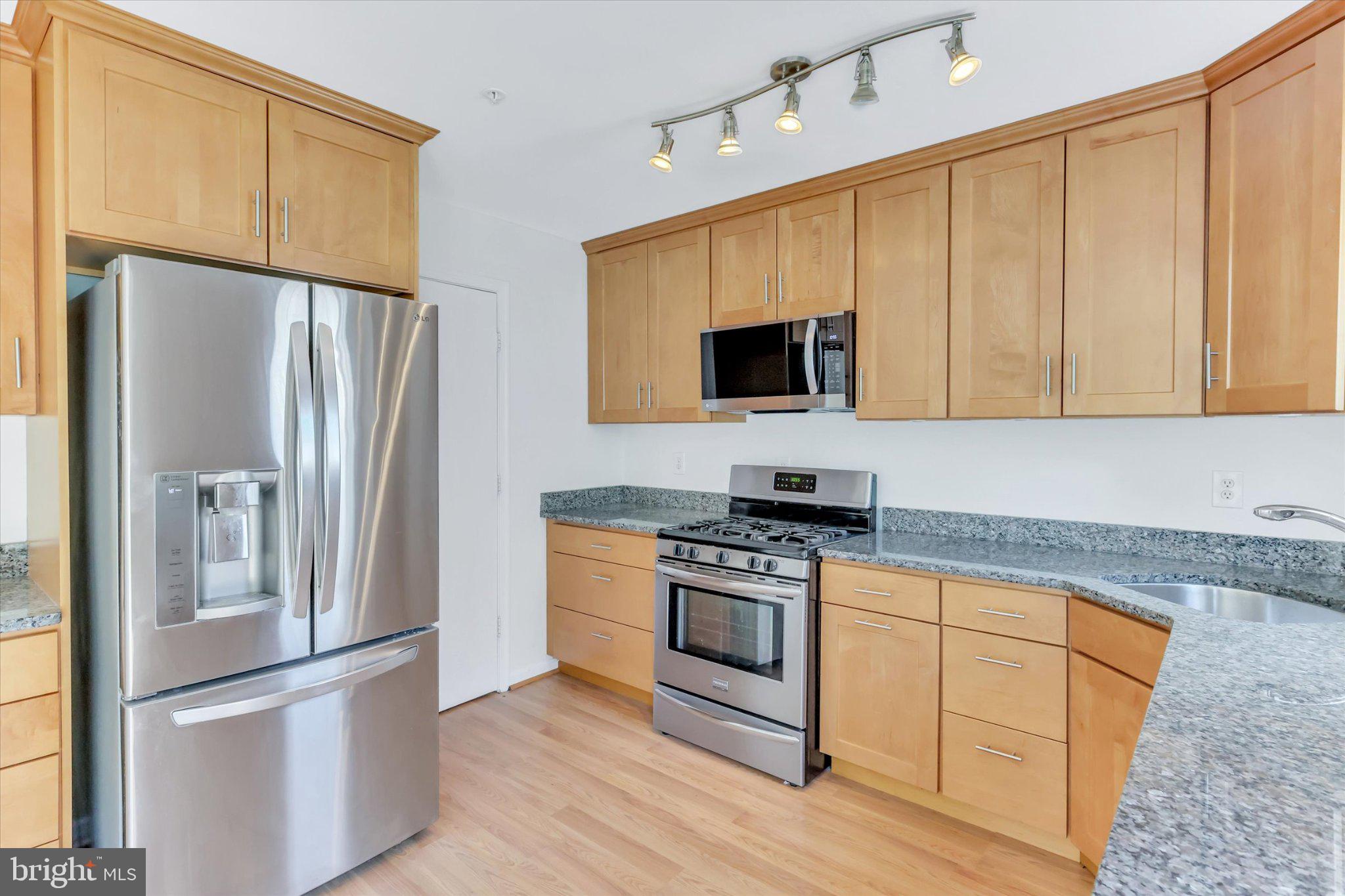 14323 Gate Dancer Lane Boyds, MD 20841 - Photo 37 of 54 Modern kitchen with sleek finishes.