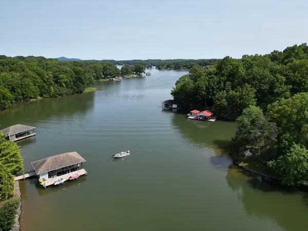 an aerial view of a house with a lake view